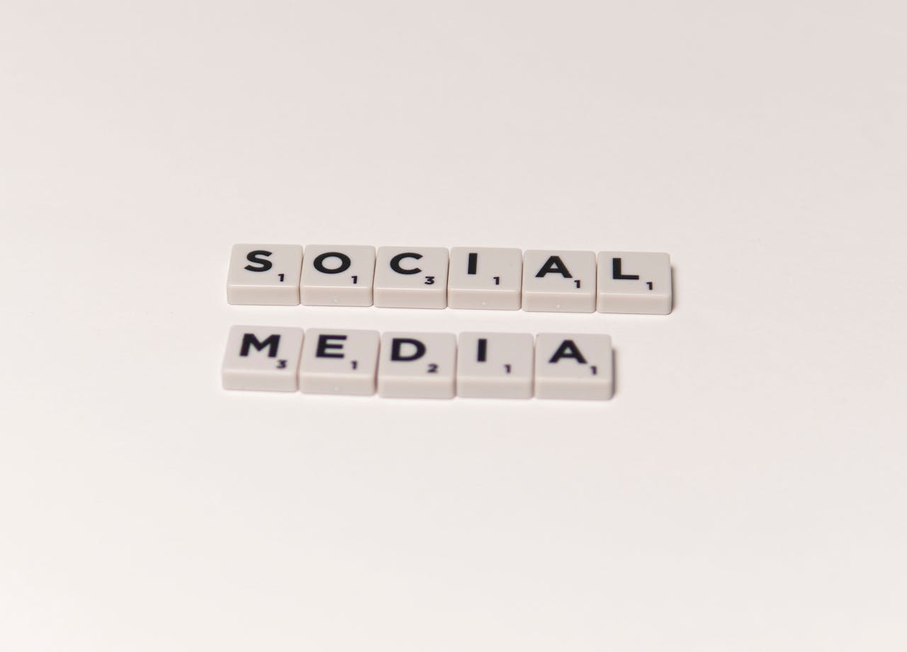 services-04 Scrabble tiles spelling social media on a white background, representing digital communication concepts.